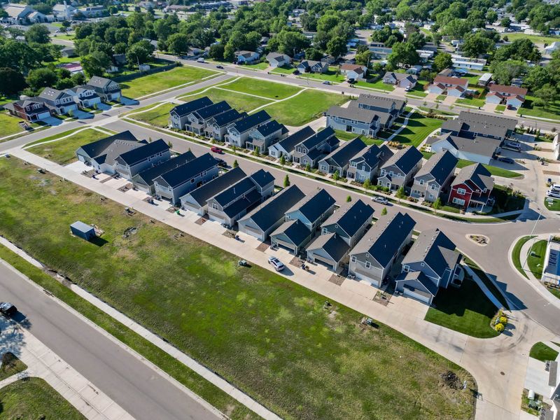 Aerial view of the Heritage Commons community in Andover, KS, showing layout and nearby surroundings (Image 16). Aerial view of the Heritage Commons community in Andover, KS, showing layout and nearby surroundings (Image 16).