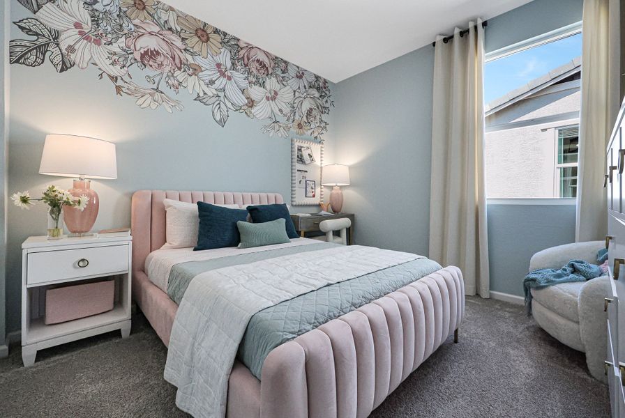 A bedroom with a bed and lamps. A bedroom with a bed and lamps.