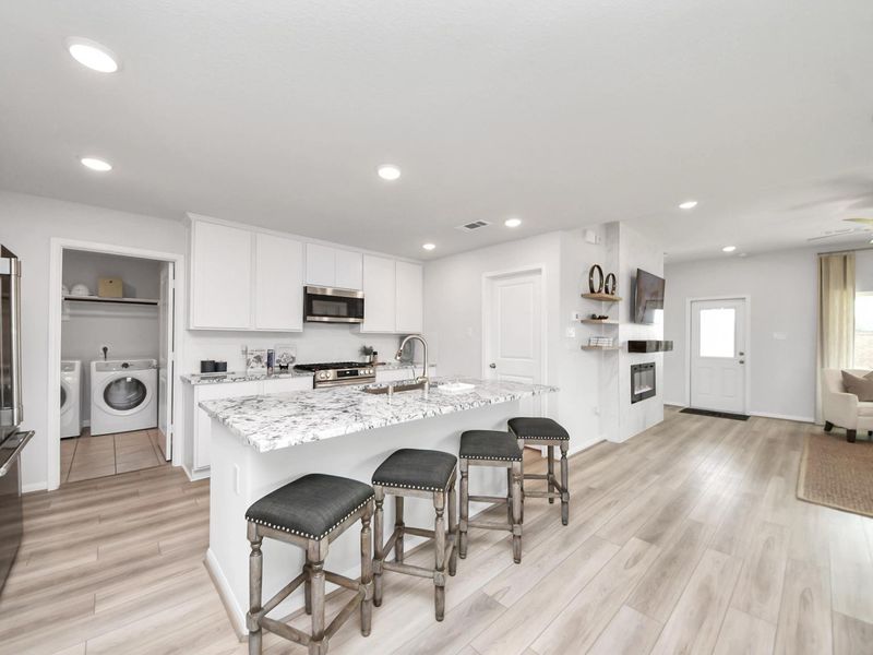 Furnished interior in a model home at Sunterra in Katy (Image 5).