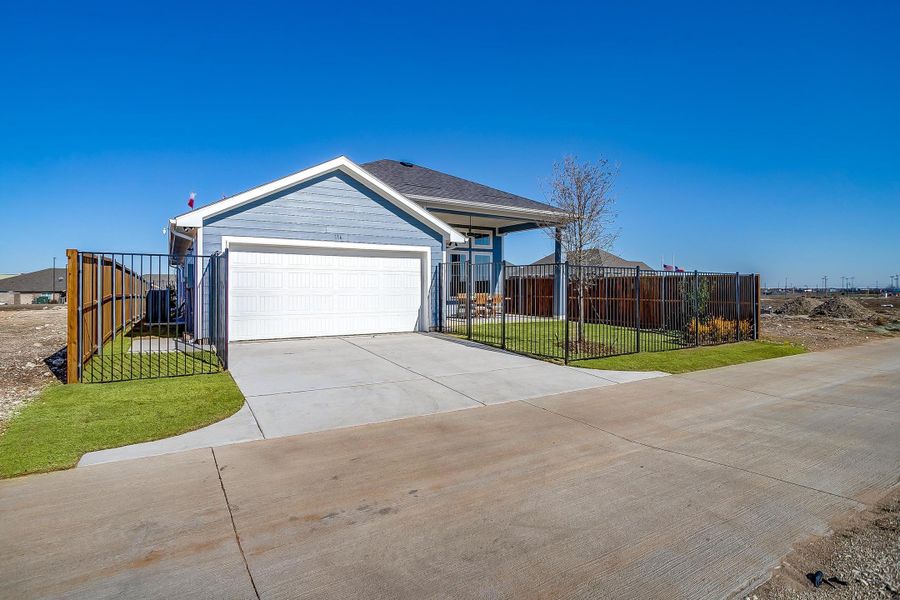 Front exterior of a home in the MidTowne community, located in Midlothian, TX (Image 9).