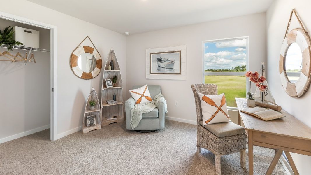 Furnished interior in a model home at Cali Cove in Punta Gorda (Image 19).