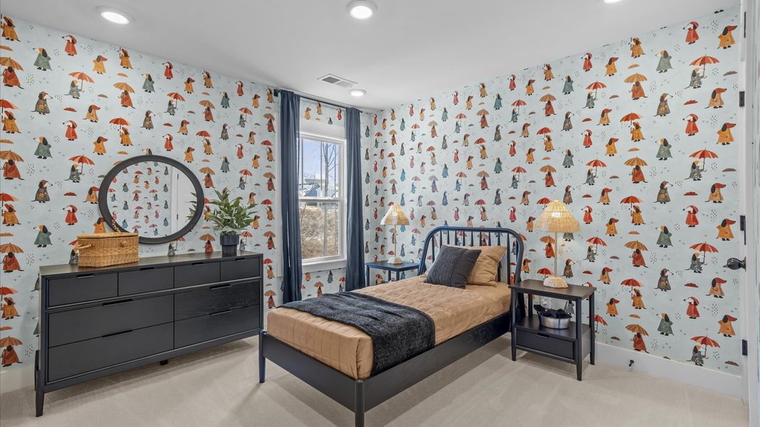 Tasteful bedroom with plush carpet, a walk-in closet, and a large window for abundant natural light at Robert's Farm