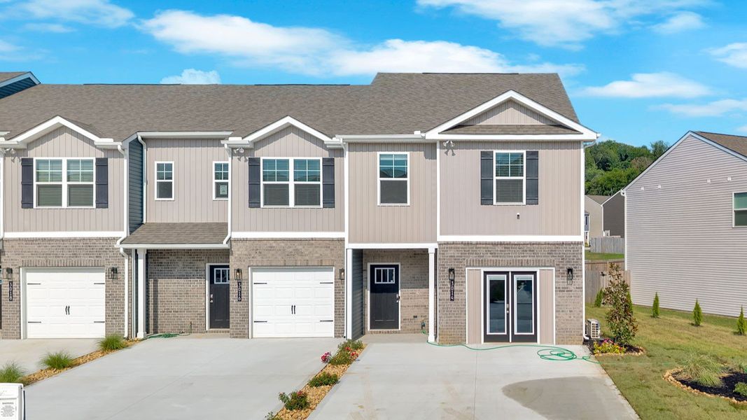 Front exterior of a home in the Spring Lake Farms Townhomes community, located in Knoxville, TN (Image 1).