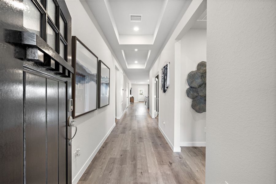 A long hallway with doors.