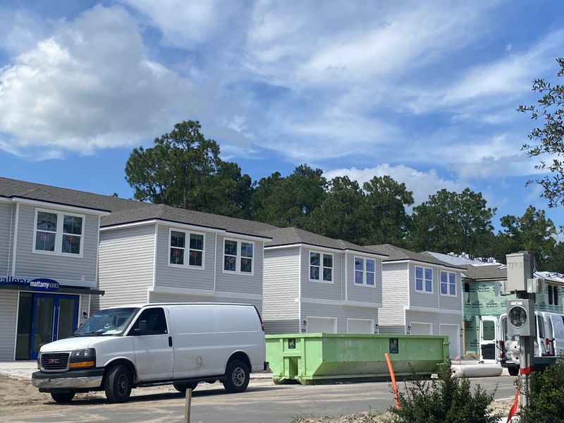 Newly constructed townhomes in Egret Creek by Mattamy Homes, featuring modern design, nestled in Jacksonville, FL.
