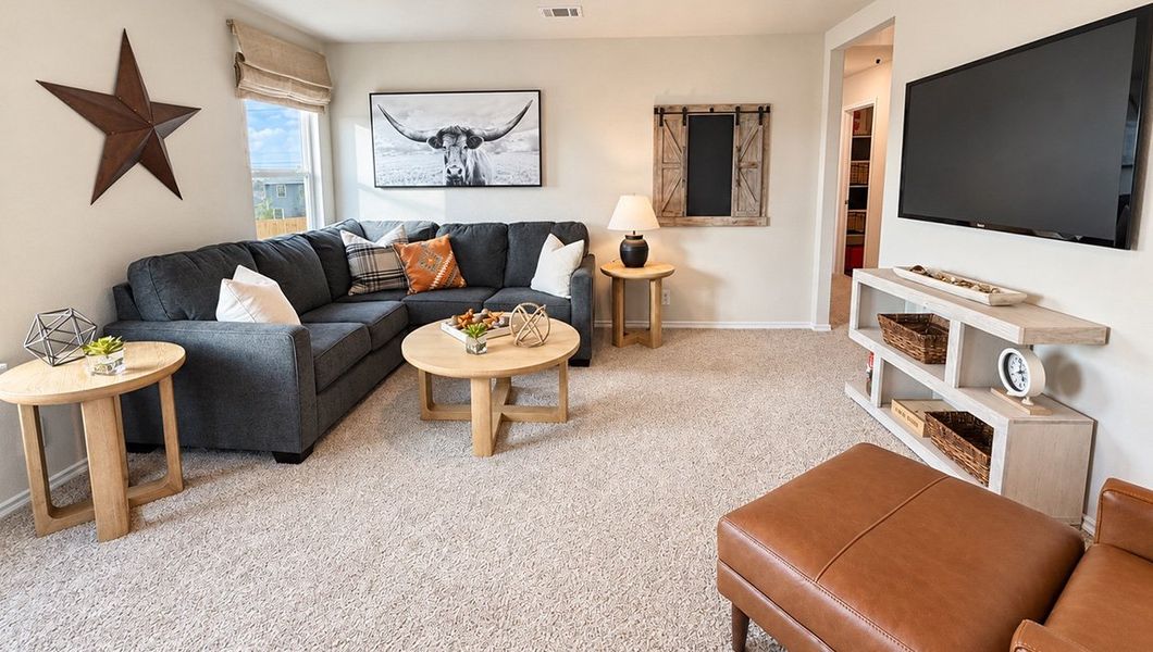Furnished interior in a model home at Redbird Ranch in San Antonio (Image 39).