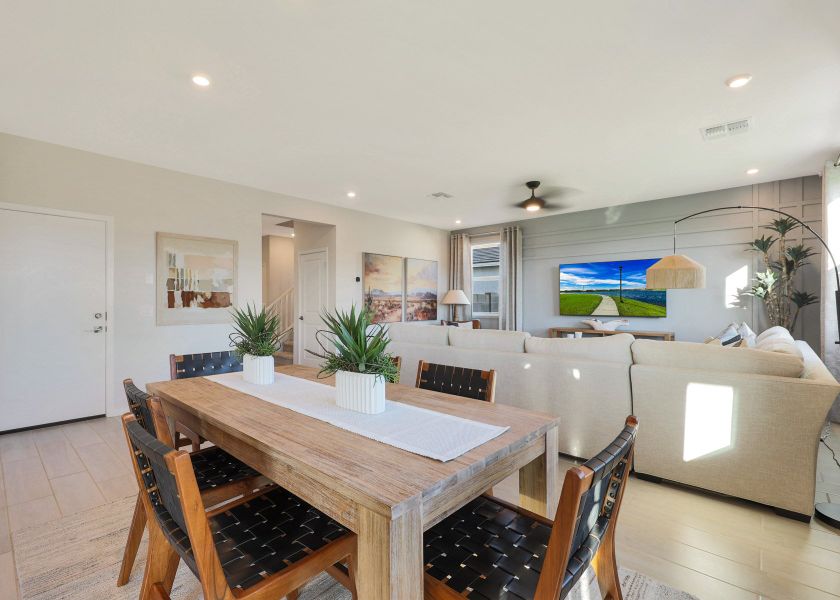 A dining room table with a couch and a couch. A dining room table with a couch and a couch.