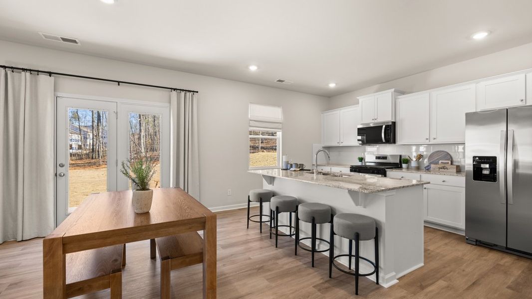 Furnished interior in a model home at South Wind in Fairburn (Image 6).