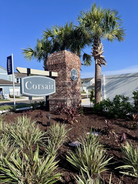 Charming brick entrance with lush landscaping at Corsair by D.R. Horton in Middleburg, FL.