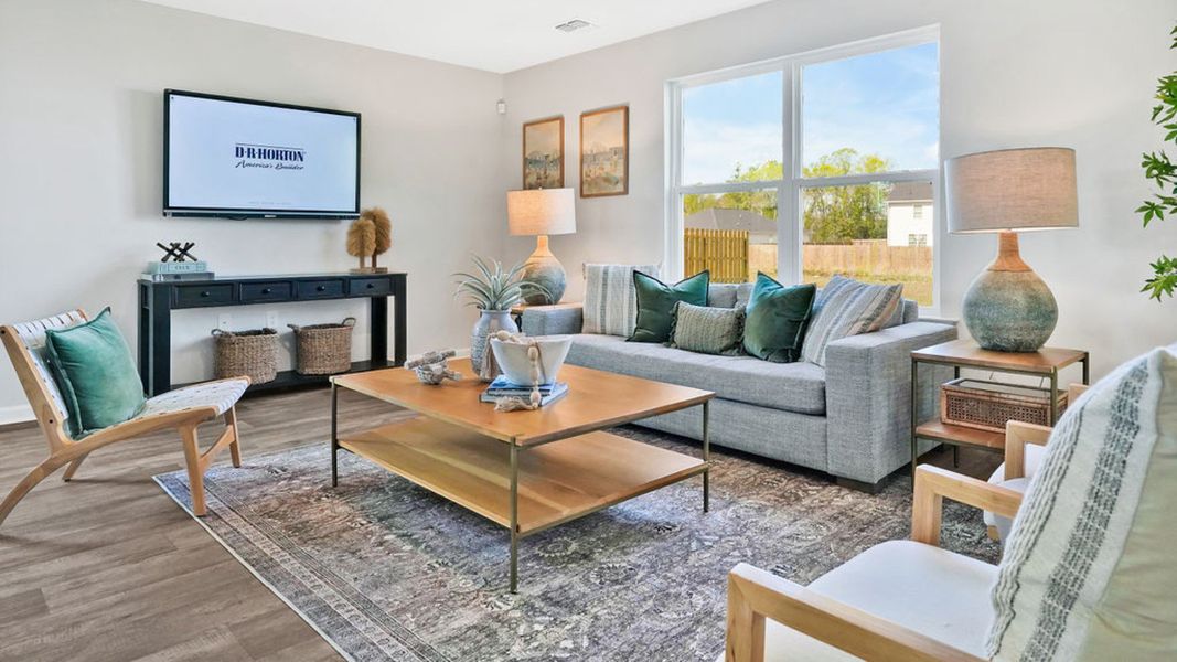 Furnished interior in a model home at Bella Point in Bolivia (Image 13).