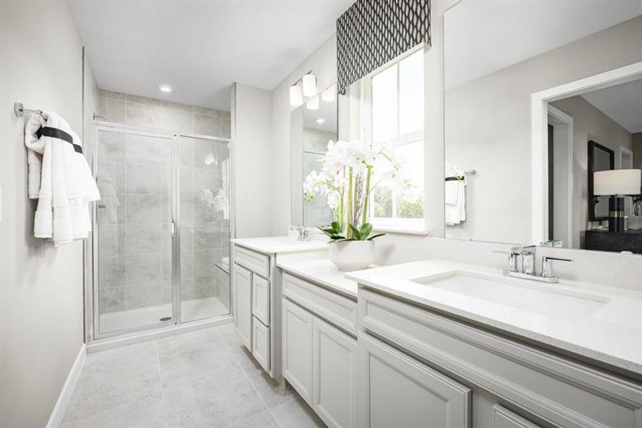 Dual vanities, a spacious shower, and a serene setting to recharge at the end of the day.​