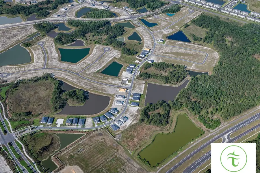 Aerial view of the Tamarack at Two Rivers community in Zephyrhills, FL, showing layout and nearby surroundings (Image 1).