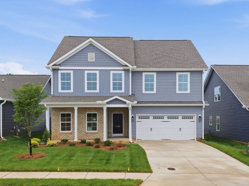 Front exterior of a home in the Sullivans Reserve community, located in Walkertown, NC (Image 12). Front exterior of a home in the Sullivans Reserve community, located in Walkertown, NC (Image 12).