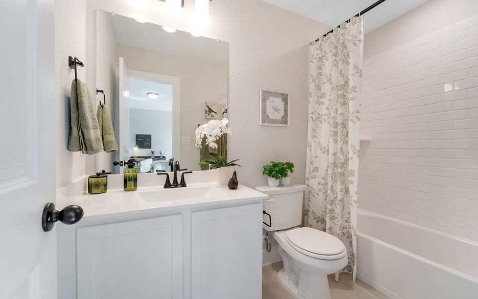 Furnished interior in a model home at Grande Estates in Bertram (Image 35).