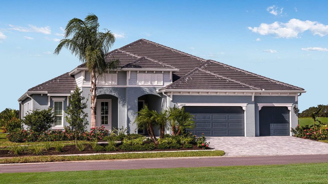 Front exterior of a home in the Grand Park Real Estate and Homes for Sale in Sarasota, FL - Neal Communities community, located in Sarasota, FL (Image 3).