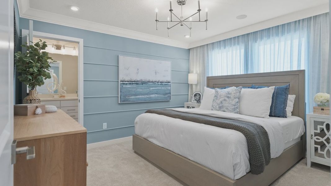 The primary suite bedroom at Cyrene at Harmony by DRB Homes offers a spacious retreat with comfort and style The primary suite bedroom at Cyrene at Harmony by DRB Homes offers a spacious retreat with comfort and style