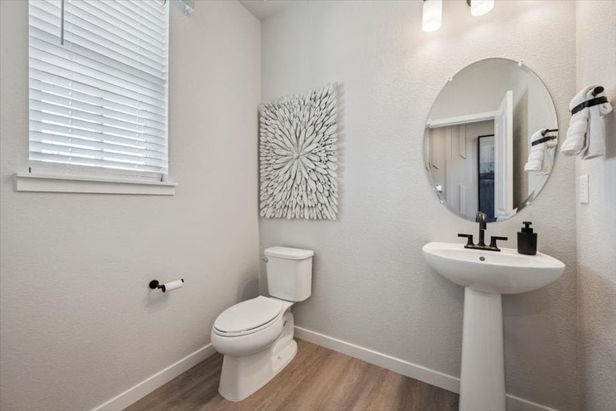 A bathroom with a mirror and sink.