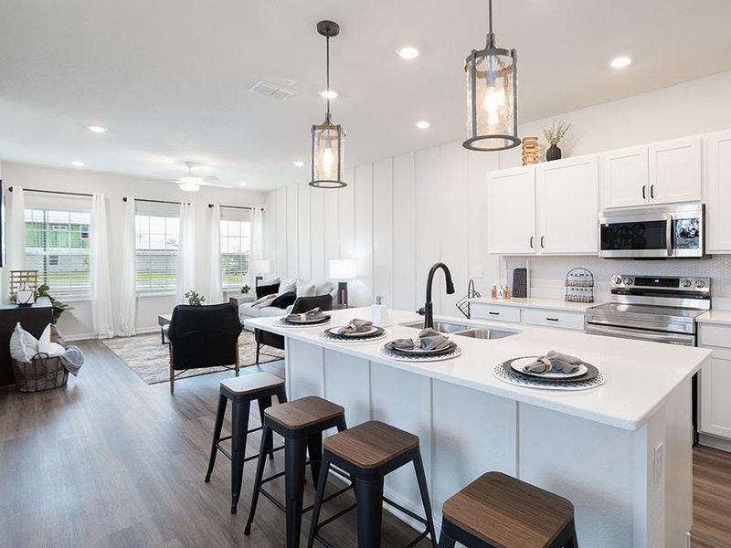 Inside, you`ll find a bright and open living area, complete with beautiful finishes - Aria model home in St. Cloud, FL Inside, you`ll find a bright and open living area, complete with beautiful finishes - Aria model home in St. Cloud, FL