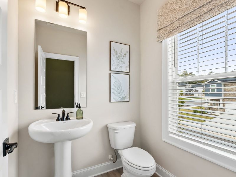 The half bathroom is conveniently located on the second floor for guests.
