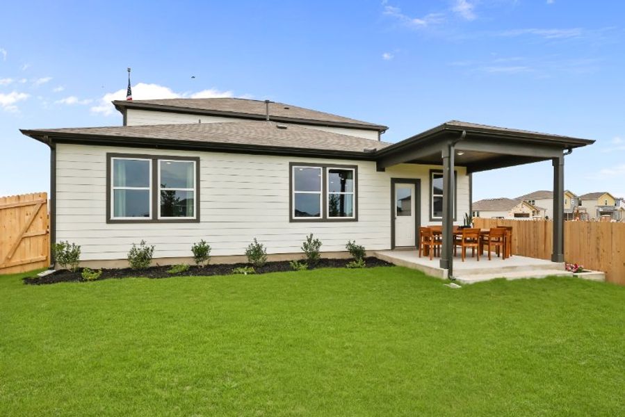 A house with a lawn and a fence. A house with a lawn and a fence.
