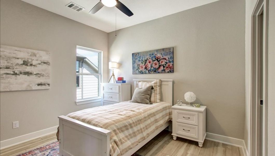 Furnished interior in a model home at Sunterra 40 in Katy (Image 38).