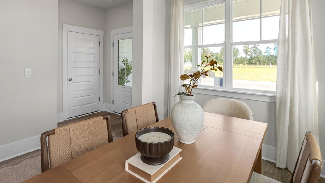 Furnished interior in a model home at The Palms at Indigo Preserve Townhomes in Leland (Image 9).
