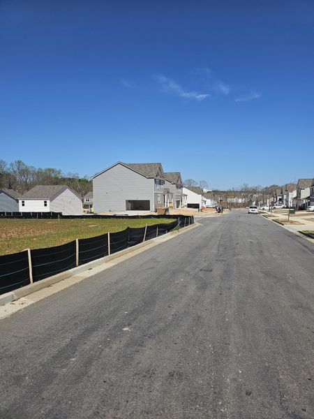 A new residential street with modern homes under construction in Braselton Village by D.R. Horton (Braselton, GA).