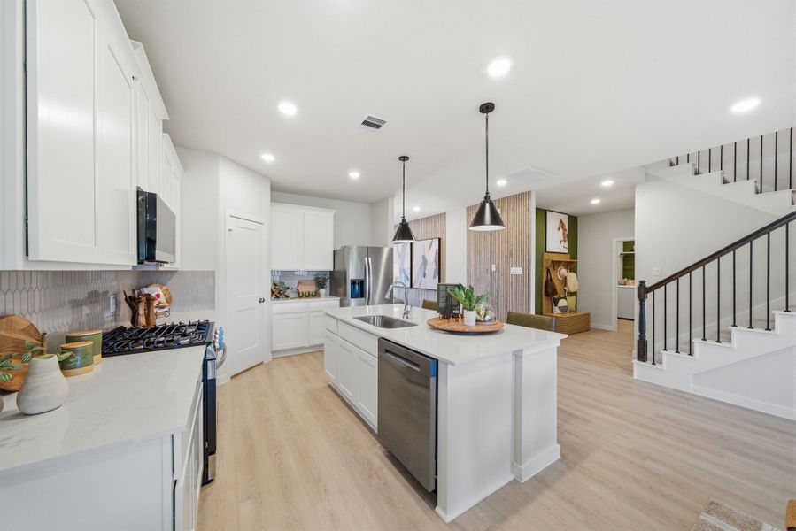 A kitchen with white cabinets. A kitchen with white cabinets.