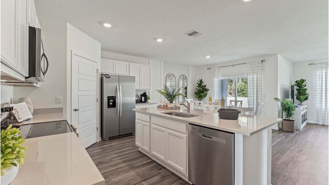 Furnished interior in a model home at Magnolia Pointe in Umatilla (Image 8).