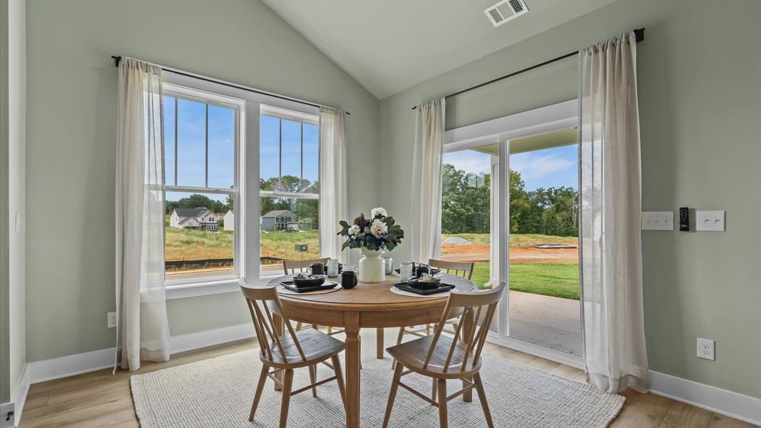 Serene breakfast area with large windows in two story home at Mulberry Estates by DRB Homes in Simpsonville, SC
