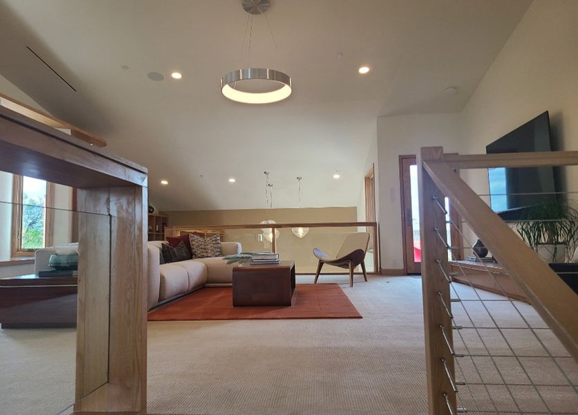 A cozy living room featuring a modern sofa, accent chair, and stylish lighting with a warm, inviting atmosphere. A cozy living room featuring a modern sofa, accent chair, and stylish lighting with a warm, inviting atmosphere.