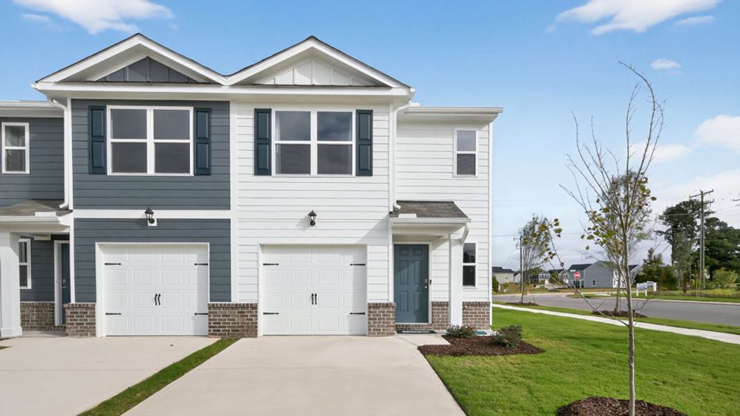 Front exterior of a home in the The Townes at Belle Grove community, located in Wendell, NC (Image 5).