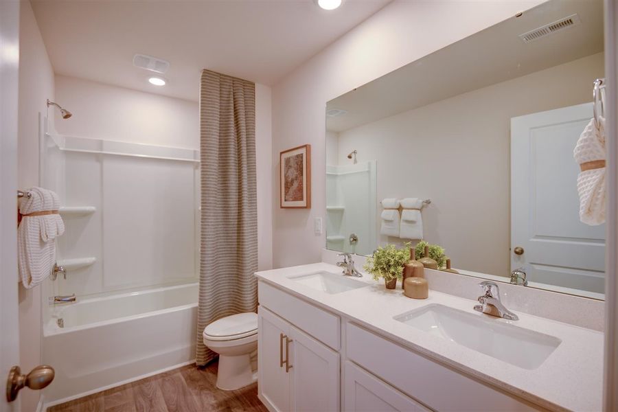 Furnished interior in a model home at Corinth Village in Greensboro (Image 7).