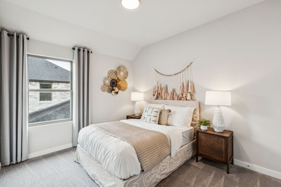 REPRESENTATIVE PHOTO – Bedroom in a Lakehaven Oak model home in Farmersville TX by Trophy Signature Homes