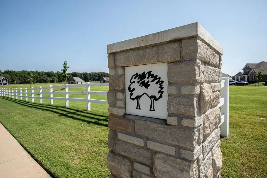 Entrance to the Twin Oaks community in Oakland, TN, featuring signage and landscaping (Image 14). Entrance to the Twin Oaks community in Oakland, TN, featuring signage and landscaping (Image 14).
