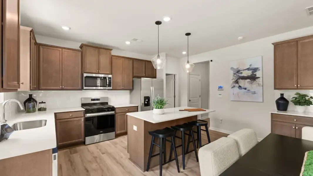 Furnished interior in a model home at Enclave at Stonewall Tell in South Fulton (Image 5).