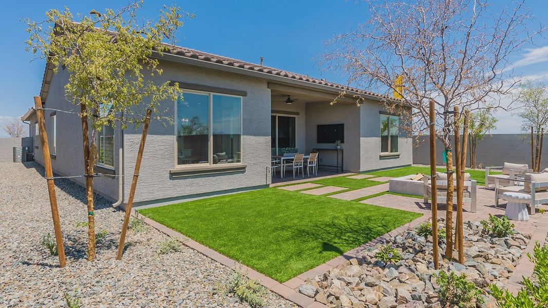 Sleek Arizona residence featuring expansive windows and meticulously crafted outdoor spaces in Windrose community.