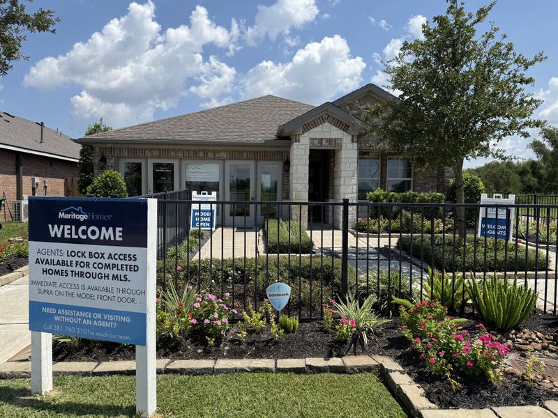 A charming stone-brick home with manicured landscaping in Glendale Lakes by Meritage Homes (Rosharon, TX). A charming stone-brick home with manicured landscaping in Glendale Lakes by Meritage Homes (Rosharon, TX).