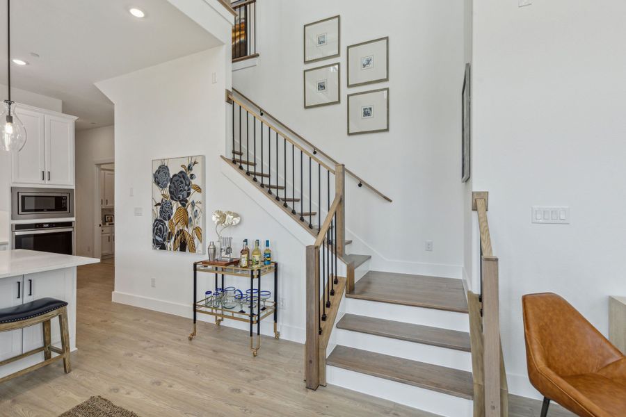 Furnished interior in a model home at Newman Village Townhomes in Frisco (Image 23).