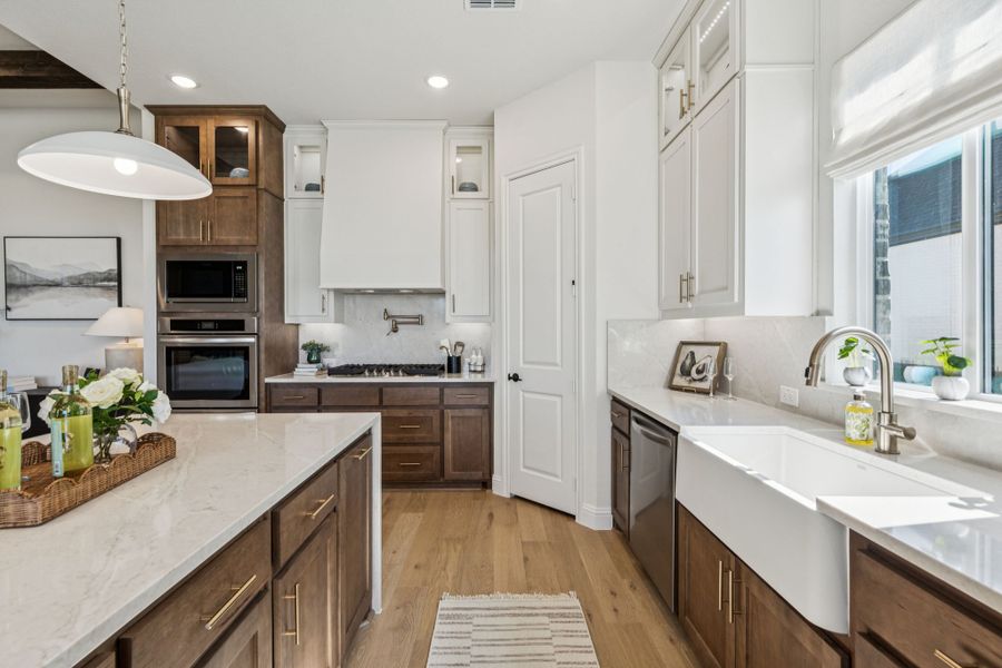 Furnished interior in a model home at Settler's Glen in New Fairview (Image 8).
