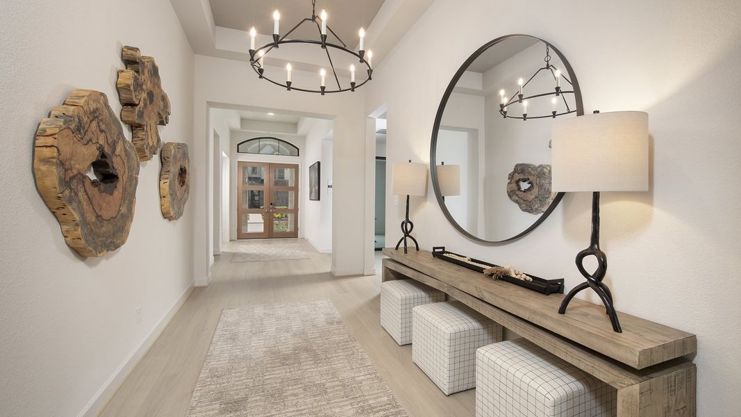 Furnished interior in a model home at The Highlands 65' in Porter (Image 5).