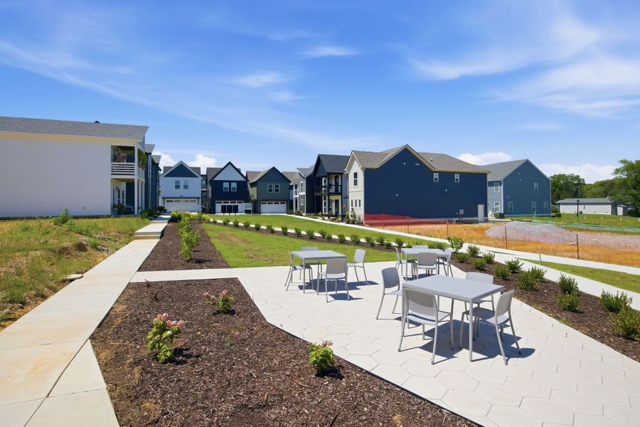 Residents enjoy shared green spaces and gathering areas designed to encourage connection and outdoor living at The Parks of Mill Town.