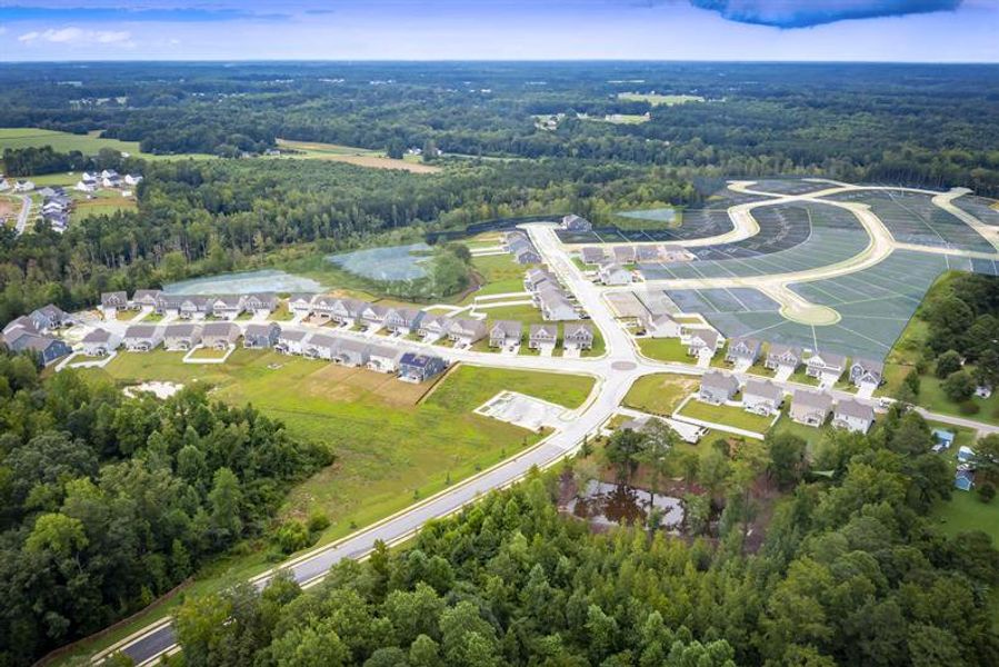 Aerial view of the Highland Ridge community in Willow Spring, NC, showing layout and nearby surroundings (Image 1).