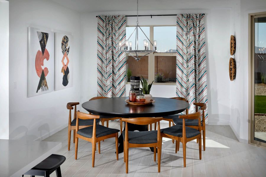 Dining Room in Amber Floorplan modeled at The Enclave at Mission Royale