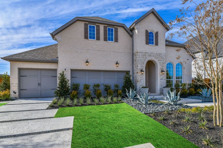 Front exterior of a home in the The Grove Frisco - 55s community, located in Frisco, TX (Image 4). Front exterior of a home in the The Grove Frisco - 55s community, located in Frisco, TX (Image 4).
