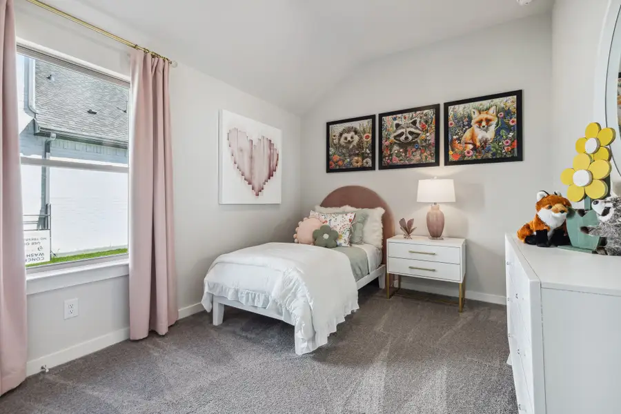 REPRESENTATIVE PHOTO – Bedroom in a Diamond model home by Trophy Signature Homes