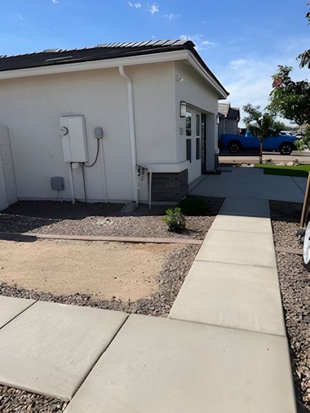 A modern home with clean lines and landscaping in Trouvaille by D.R. Horton, Phoenix, AZ.