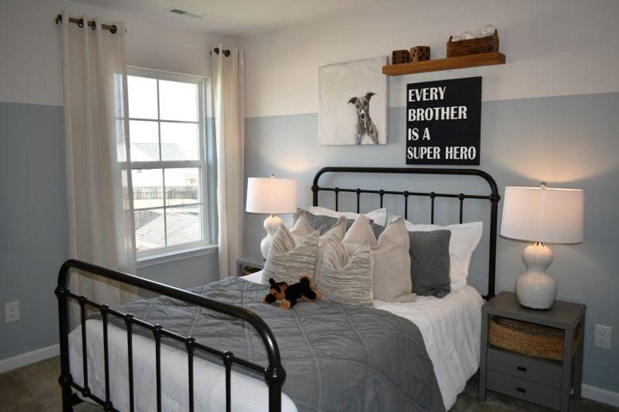 Furnished interior in a model home at Brassfield Meadows in Burlington (Image 43).