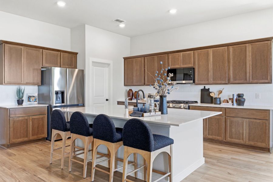 A kitchen with a large island. A kitchen with a large island.