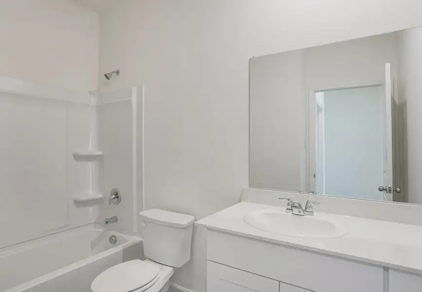 Furnished interior in a model home at The Landing in New Caney (Image 15).